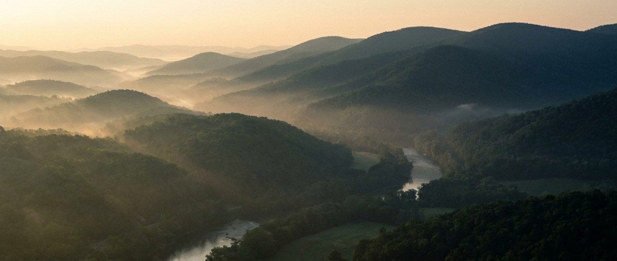 Online Therapy Greenville, SC — soft misty Blue Ridge foothills at dawn near Greenville, South Carolina